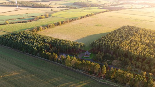 Beautiful countryside landscape of fields, trees, hills and lakes